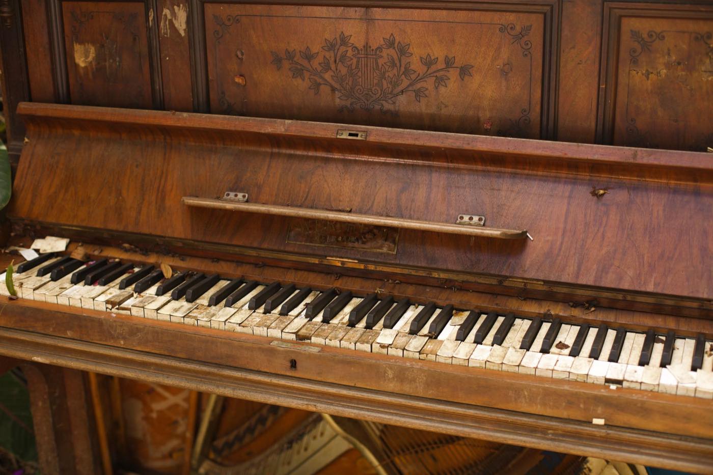 Old wooden upright piano ready for disposal